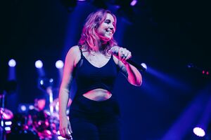 Broussard performing live with The Midnight in 2021